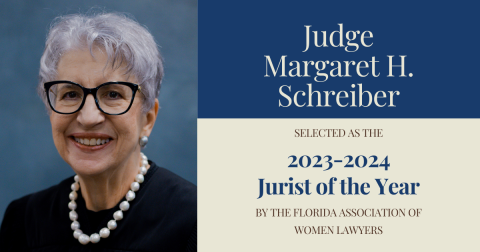 Photo of Judge Schreiber with the announcement that she has been named FAWL's Jurist of the year.