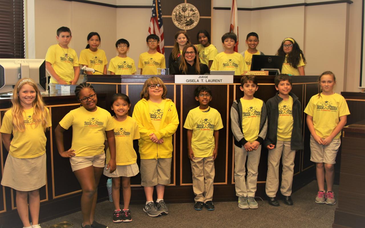 Orange County Judge Gisela Laurent with students from the Star Child Academy